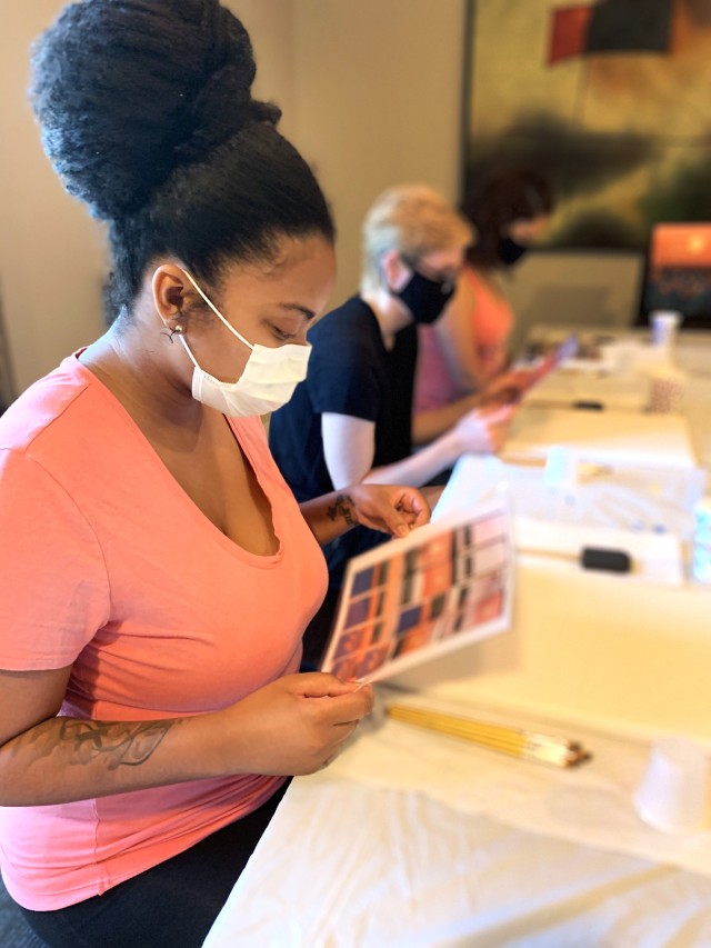 U.S. Air Force Tech. Sgt. Nicole Seaward, an intensive care unit technician assigned to COVID Theater Hospital-1, Travis Air Force Base, Calif., participates in a painting class in Stockton, Calif., taught by a member of the behavior health team...