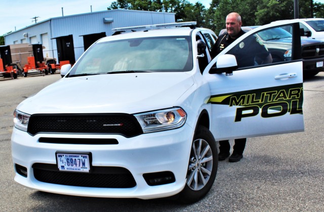 Police Sgt. Kevin Eckelberg gets into a new police cruiser June 25, 2020, assigned to the Fort McCoy Directorate of Emergency Services Police Department at Fort McCoy, Wis. The department received this first Dodge Durango-based cruiser for use...
