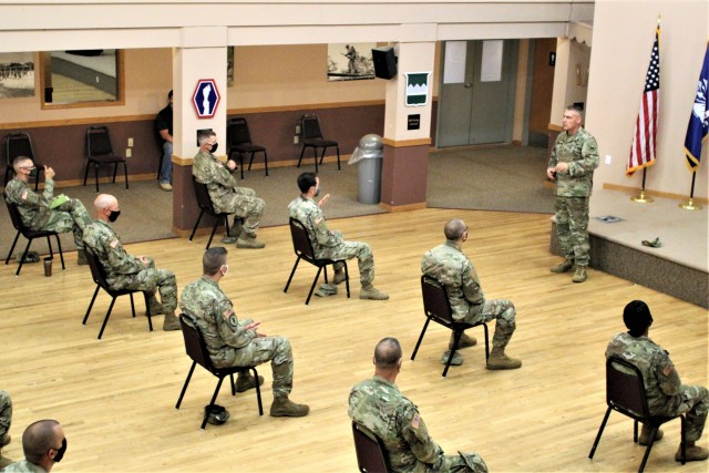 Command Sgt. Maj. Andrew Lombardo, who serves as the command sergeant major of the Army Reserve, talks with Soldiers on Aug. 28, 2020, in building 905 at Fort McCoy, Wis. The enlisted call was a specially coordinated event with social distancing and other safety measures in place. The event provided a chance for Soldiers to hear the latest updates from the leadership level of the Army Reserve and a chance for those same Soldiers to ask the enlisted leader any questions they may have. The call was part of a five-day visit by Lombardo where he visited with Reserve Soldiers training in the 78th Training Division Operation Ready Warrior as well as with Reserve Soldiers attending institutional training at Fort McCoy. Lombardo visited Fort McCoy’s Regional Training Site-Maintenance as well as the Fort McCoy Noncommissioned Officer Academy. The senior enlisted leader also visited with members of senior leadership throughout Fort McCoy. The Army Reserve of today can trace its roots as a "national" or federal Citizen-Soldier force that goes back more than a century. Over the years, with the crisis of a major war, the federal government mobilized large Citizen-Soldier forces and trained them for combat operations. Today, the Army Reserve has more than 200,000 Soldiers and Civilian employees and 2,000 units spread across 20 time zones. (U.S. Army Photo by Scott T. Sturkol, Public Affairs Office, Fort McCoy, Wis.)