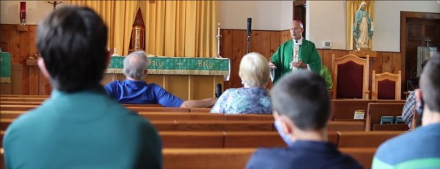 Bishop Richard Spencer of the Archdioceses of Military Services helps conduct Catholic Mass on July 19 at Fort McCoy. (Photo by Dale Gibson/Religious Support Office)