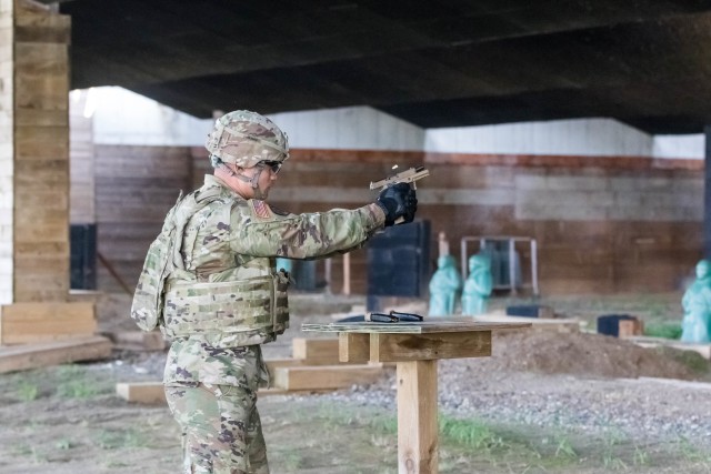 Sgt. 1st Class James Smith fires an M17 Sig Sauer service pistol at the firing range on U.S. Army Garrison Humphreys, South Korea Aug. 24, 2020. The Pittsburg, California native is a platoon sergeant assigned to 557th Military Police Company, 94th Military Police Battalion, 19th Expeditionary Sustainment Command, Eighth Army, who completed the service pistol qualification event as part of the U.S. Army Pacific Best Warrior Competition 2020. The USARPAC BWC 2020 is an annual week-long competition including competitors from across the Pacific. This year, due to COVID-19, the competition takes place across the Indo-Pacific with competitors conducting events at their home station and participating in a virtual knowledge board presided by the USARPAC Command Sergeant Major.  The noncommissioned officers and junior-enlisted competitors are evaluated in several categories such as general military knowledge, basic Soldier skills, and physical fitness. (U.S. Army photo by Pfc. Dong Hyun Kim)