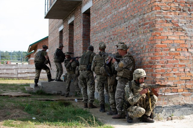 Armed Forces Ukraine soldiers practice urban operations under the guidance of their instructor, Aug. 26 at Combat Training Center-Yavoriv, Ukraine. (Photo by Sgt. Gregory Glosser, JMTG-U Public Affairs)