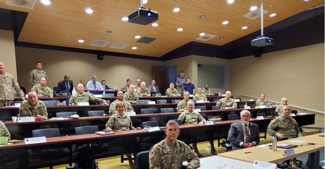 Pictured from right to left, (First Row) Maj. Gen. Dennis LeMaster, Mr. J.M. Harmon III, Maj. Gen. Joseph Robinson; (Second Row) Brig. Gen. Jill Faris,  Maj. Gen. Michael O’Guinn, Brig. Gen. Paula Lodi; (Third Row) Brig. Gen. Beth Salisbury, Brig. Gen. Michael Pyle, Brig. Gen. Joseph Heck, Brig. Gen. Shan Bagby, Brig. Gen. Carl Reese and several other general officers and members of the Senior Executive Service (SES) pose with other senior leaders and planners during the Medical Supporting Concept Seminar hosted by the U.S. Army Medical Center of Excellence from August 25-28, 2020 on Joint Base San Antonio-Fort Sam Houston.  In total, there were over 60 virtual and in-person attendees to include 20 general officers and members of the senior executive service from all three Army components: regular Army, Army National Guard, and Army Reserves.   In person attendees adhered to COVID-19 mitigation measures which includes at least 6 feet of social distance and wearing face coverings when social distance cannot be maintained.