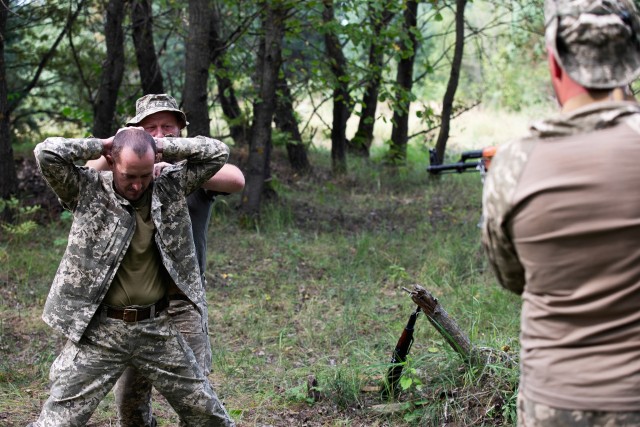 Armed Forces Ukraine soldiers practice detainee operations under the guidance of their instructor, Aug. 26 at Combat Training Center-Yavoriv, Ukraine. (Photo by Cpl. Shaylin Quaid, JMTG-U Public Affairs)