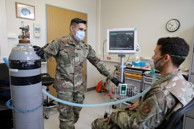 Staff Sgt. Michael Hernandez, the noncommissioned officer in charge of the respiratory department at Landstuhl Regional Medical Center, administers nitrogen using a high altitude simulation test.