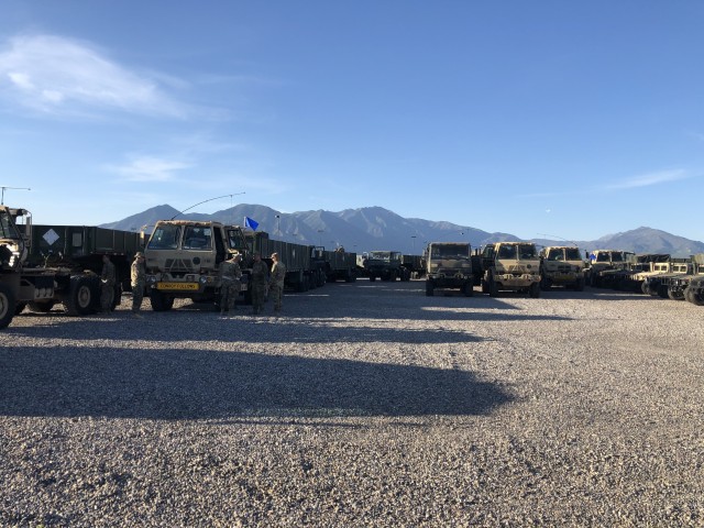 118 TC's SSG Jeffery Clement, convoy commander, and SGT Jason
Averett, assistant convoy commander, conduct a Pre-Convoy Inspection (PCI)
of SPC Vincent Rasmussen's equipment prior to movement to TEAD, UT at
Spanish Fork Armory, UT.