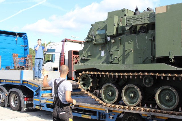 A Multiple Rockets Launch System is loaded onto a truck bound for Tapa, Estonia for Rail Gunner Rush Aug. 27, 2020, in Grafenwoehr, Germany. Rail Gunner Rush is the first live fire exercise for the 41st Field Artillery Brigade outside of Grafenwoehr, Germany, since their reactivation in 2018. (U.S. Army photo by Pfc. Mathew Garrett)