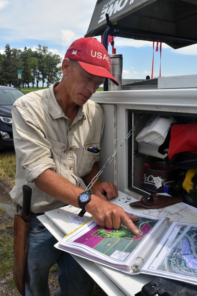 Paul Johnson, St. Paul District survey technician, reviews a map prior to placing survey monuments along the Red River of the North, near Georgetown, Minnesota, Aug. 11. The Corps of Engineers, St. Paul District, in partnership with the Rock Island and Omaha districts and the FM Diversion Authority, are placing monuments to get a better understanding of the environment within the region and to monitor for any potential impacts related to the construction and/or operation of the Fargo – Moorhead Metro Diversion Flood Risk Management Project.