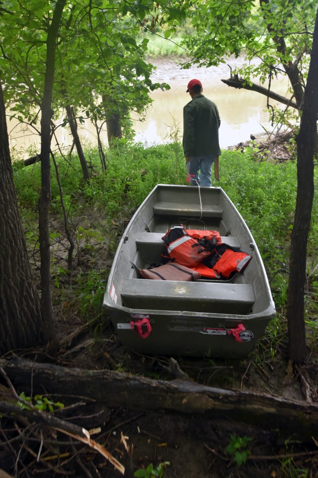 Paul Johnson, St. Paul District survey technician, pulls a survey boat through the woods to get to the Red River of the North, near Georgetown, Minnesota, Aug. 12. The Corps of Engineers, St. Paul District, in partnership with the Rock Island and...