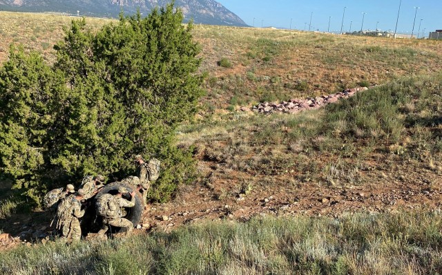 Soldiers with 1st Battalion, 12th Infantry Regiment, 2nd Stryker Brigade Combat Team, 4th Infantry Division roll a tire up a hill during the first week of Platoon Leader Assessment Selection Program Aug. 17-28 at Fort Carson, Colorado. The program, first held July 2019 and unique to the battalion, assesses and prepares lieutenants in the battalion to be assigned to positions that will challenge them and set them up for success during their time in the battalion and the U.S. Army. (U.S. Army photo by Capt. Chelsea Durante)
