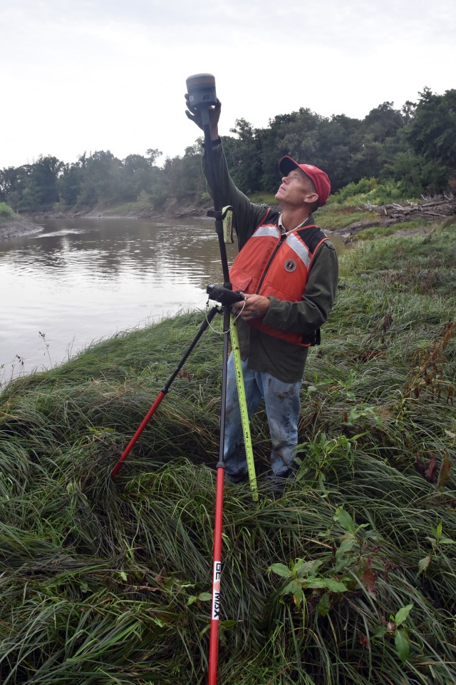 Paul Johnson, St. Paul District survey technician, uses his survey equipment to register a survey monument along the Red River of the North, near Georgetown, Minnesota, Aug. 12. The Corps of Engineers, St. Paul District, in partnership with the Rock Island and Omaha districts and the FM Diversion Authority, are placing monuments to get a better understanding of the environment within the region and to monitor for any potential impacts related to the construction and/or operation of the Fargo – Moorhead Metro Diversion Flood Risk Management Project.