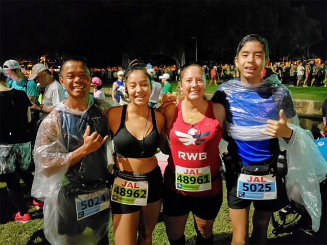 The Tugaoen family pauses for a photo together before starting the 2018 Honolulu Marathon and the Start to Park 10K.
