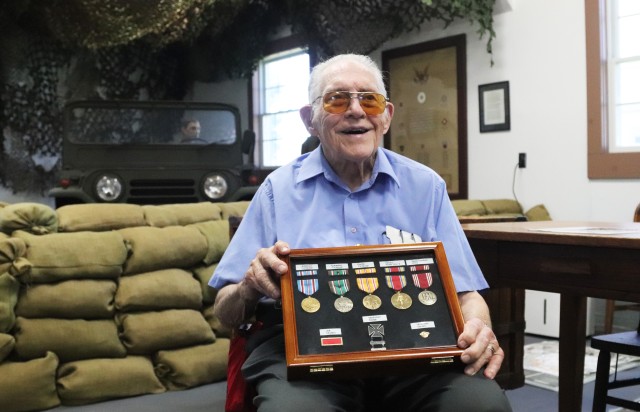 World War II veteran Donald Whitaker, who served in the Army from 1943 to 1946, holds a display case July 16, 2020, with the medals he earned during the war while visiting the Commemorative Area at Fort McCoy, Wis. Whitaker, of Elk Grove, Wis., and originally from DuPage County, Ill., made his first visit to Fort McCoy after having left 75 years earlier. When he left the Army, he was Technician Fifth Grade Donald Whitaker and was a bandsman with the 86th Infantry Division Band. Whitaker had served in the European theater of the war in Austria and Germany as well as the Pacific theater in the Philippines. He served for 2 1/2 years in various other support roles as well. (U.S. Army by Scott T. Sturkol, Public Affairs Office, Fort McCoy, Wis.)