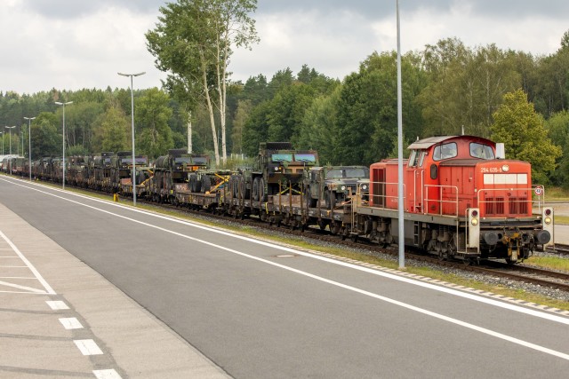 U.S. Soldiers, assigned to 41st Field Artillery Brigade, load vehicles and equipment onto a train headed to Tapa, Estonia, for Rail Gunner Rush Aug. 19, 2020, in Grafenwoehr, Germany.Rail Gunner Rush is the first-live fire exercise for the 41st FAB outside of Grafenwoehr, Germany, since their reactivation in 2018. (U.S. Army photo by Spc. Ryan Barnes)