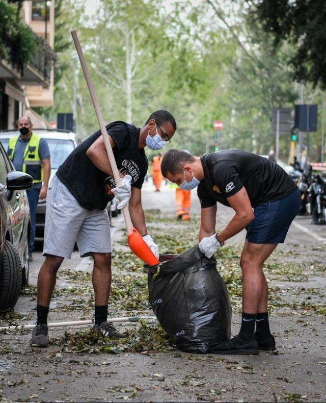 Soldiers from Dental Health Activity-Italy clean debris from the streets of Verona after a violent storm wreaked havoc on the city Aug. 23.