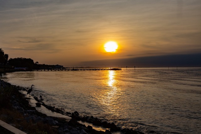 FORT BENNING, Ga. – A December 2019 view of sunset, looking across Choctawhatchee Bay from the Destin Army Recreation Area, in the Florida panhandle, about 220 miles south of Fort Benning. The resort is popular with members of the U.S. military community. When Hurricane Michael tore through the region in October 2018, it did major damage to the recreation area's marina, seawall and boating channel. Work has begun on repairing the seawall. The marina was repaired last year. Plans also call for a project that will eventually dredge the boating channel.

(U.S. Army photo)