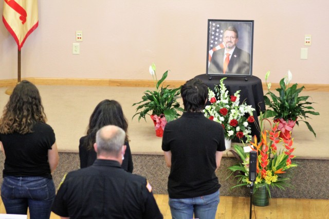 Fort McCoy community members and friends and family of James C. Hamilton III gathered for a socially distanced memorial service Aug. 14, 2020, in building 905 at Fort McCoy, Wis. Hamilton was the former director of the Directorate of Emergency...
