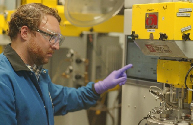 Patrick Hogan, Veloxint senior engineering manager, operates a lab scale powder mill to produce nanocrystalline alloy powder. 