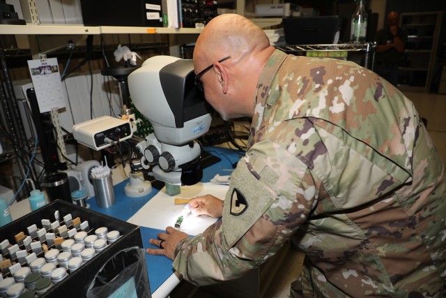 200817-A-BS696-1864
CHAMBERSBURG, Pa.
Chief Warrant Officer 3 Jesus Gonzalez inspects solder joints on a PATRIOT antenna element under a microscope as part of the Training With Industry (TWI) internship at Letterkenny Army Depot. The Training With Industry (TWI) program is a one year internship that embeds a selected warrant officer into the Organic Industrial Base. The goal of the TWI program is to develop the Warrant Officer’s experience in advanced managerial techniques and provide insight into the relationship between the warrant officer’s industry and specific functions in the Army and Air Defense Artillery (ADA) community.

(U.S. Army photo by Pam Goodhart LEAD)