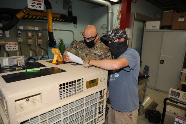 200817-A-BS696-1853
CHAMBERSBURG, Pa.
Chief Warrant Officer 3 Jesus Gonzalez (left) goes over final test procedures for the 24K PATRIOT air-conditioner with John Neville Jr. (right), Letterkenny Army Depot (LEAD) A/C shop employee, as part of the Training With Industry (TWI) internship at Letterkenny Army Depot. The Training With Industry (TWI) program is a one year internship that embeds a selected warrant officer into the Organic Industrial Base. The goal of the TWI program is to develop the Warrant Officer’s experience in advanced managerial techniques and provide insight into the relationship between the warrant officer’s industry and specific functions in the Army and Air Defense Artillery (ADA) community.

(U.S. Army photo by Pam Goodhart LEAD)