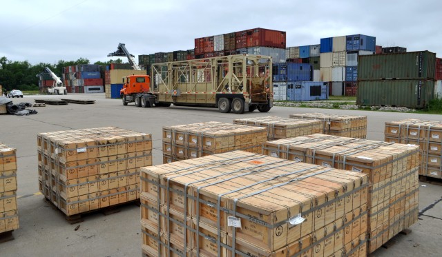 Ammo boxes await final placement in container on BGAD&#39;s primary out-loading platform.  