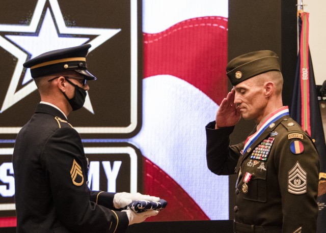 Command Sgt. Maj. Timothy A. Guden (Ret. and Right), previous command sergeant major, U.S. Army Training and Doctrine Command, renders a salute to the flag that he received at his retirement ceremony Sept. 3, 2020, Fort Eustis, Virginia. (U.S....