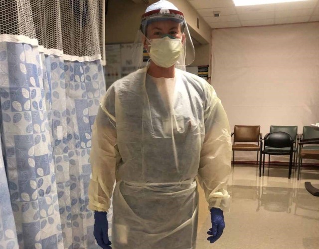 Army Capt. Sarah Kopaciewicz, a critical care nurse assigned to Urban Augmentation Medical Task Force-627 supporting Christus Santa Rosa Hospital Westover Hills in San Antonio prepares to care for COVID-19 patients. The UAMTF is composed of...