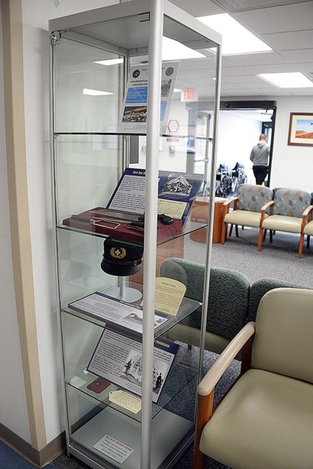 Two display cases housing Munson Army Health Center-related memorabilia from the Frontier Army Museum are on long-term exhibit at MAHC. One is located near the pharmacy and the other is by the elevators. Photo by Prudence Siebert/Fort Leavenworth...