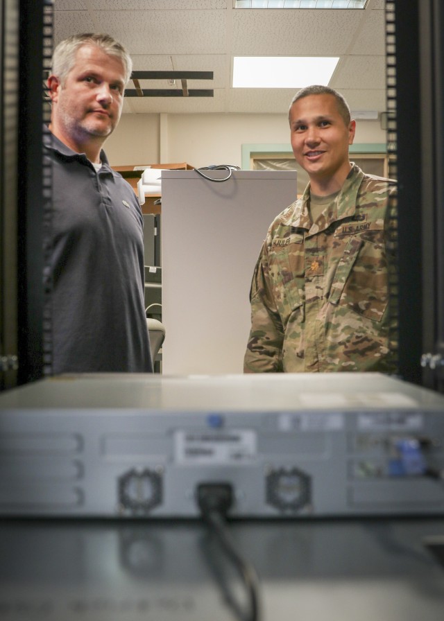 (From left) Jonathan Conway, lead network engineer, Landstuhl Regional Medical Center and U.S. Army Maj. Robert Hjuler, Chief Technology Officer, LRMC, take a look at a network server at LRMC’s Information Management Division, Aug. 19. Conway and Hjuler were recently recognized as U.S. Army Medical Department’s Health Information Technology Civilian and Officer of the year, respectively.