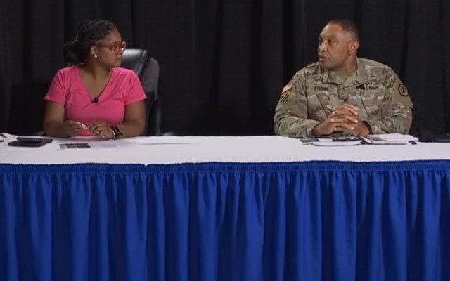 LaTrice Langston, Fort Jackson's social media manager, watches as Col. Jeremiah Stubbs, interim Public Health Emergency Officer at Moncrief Army Health Clinic speaks during a virtual town hall Aug. 27. (Screenshot)