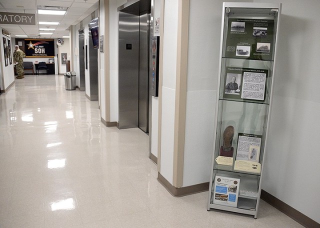 Two display cases housing Munson Army Health Center-related memorabilia from the Frontier Army Museum are on long-term exhibit at MAHC. One is located by the elevators near the information desk and the other is by the pharmacy. Photo by Prudence...