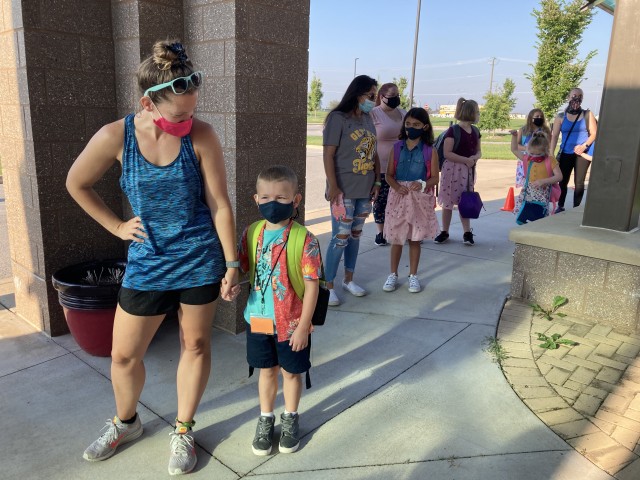 Heather Linde waits to drop of her son, Elijah, 5, Aug. 24 for the first day of school at Barkley Elementary School., Foet Campbell, Ky. She said he likes his mask because “he thinks he’s a ninja.”