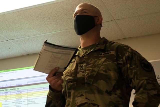 Master Sgt. Ryan Cameron, the lead organizer and cadre non-commissioned officer-in-charge of the Best Warrior Competition 2020 representing the U.S. Army Reserve Command, leads a discussion on logistics before the competition at Fort McCoy,...