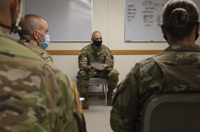 Master Sgt. Ryan Cameron, the lead organizer and cadre non-commissioned officer-in-charge of the Best Warrior Competition 2020 representing the U.S. Army Reserve Command, leads a discussion on logistics before the competition at Fort McCoy,...