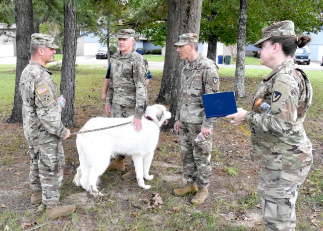 Col. Ryan K. Roseberry, Fort Polk garrison commander, (center left) and Command Sgt. Maj. Christopher M. Ausbun, garrison command sergeant major, (center right) talk to a Maple Terrace resident about the recovery progress in the aftermath of...