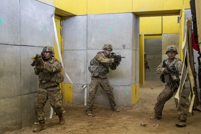 Pfc. Brian Mafuz (left), Spc. Logan Haunstein (center), and Pvt. Carl Regis (right) clear a room during a shoot house drill August 6, 2020 at Fort Drum, N.Y. Soldiers from C Co., 2nd Battalion, 14th Infantry Regiment, 2nd Brigade Combat Team, 10th Mountain Division (LI) conducted a multi-day training exercise emphasizing squad-level tasks. (U.S. Army photo by Pfc. Josue Patricio)