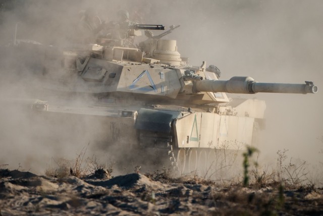 FORT BENNING, Ga. – In a November 2016 photo, an M1Abrams tank is in action during a competitive maneuver training exercise involving students of Fort Benning&#39;s Infantry and Armor basic leadership courses. Such training aids development of a...