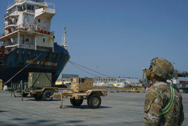 A U.S. Soldier, assigned to the 4th Squadron, 2d Cavalry Regiment, looks up at vessel during port operations for the Noble Partner 20 exercise in Poti, Georgia, Sept. 4, 2020. Exercise Noble Partner is designed to enhance regional partnerships and increase U.S. force readiness and interoperability in a realistic, multinational training environment. The exercise allows participants to conduct situational training exercises, live-fire exercises and combined mechanized maneuvers. The 4th Squadron, 2d Cavalry Regiment (Sabers) will lead the exercise for 2d Cavalry Regiment.