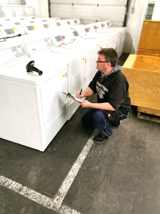 Sascha Winter, Baumholder Military Community Furnishings Management Office warehouse employee, checks a barcode against a master list of furnishings. The BMC FMO warehouse holds between 8, 000 - 12,000 pieces of furniture at any one time. 
...