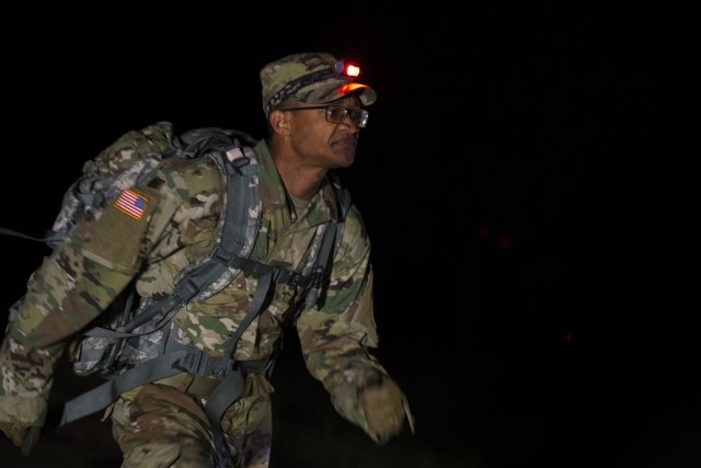 Spc. Stanley Thompson, a U.S. Army Reserve indirect fire infantryman representing the 108th Training Command (Initial Entry Training), participates in an unknown distance foot march with a minimum weight of 35 pounds during the 2020 U.S. Army Reserve Best Warrior Competition at Fort McCoy, Wisconsin, Sept. 9. Over 40 Soldiers from across the nation traveled to compete in this year’s Best Warrior, hosted from Sept. 4-10, 2020. The 2020 BWC is an annual competition that brings in the best Soldiers across the U.S. Army Reserve to earn the title of “Best Warrior” among their peers. Competitors are evaluated on their individual ability to adapt and overcome challenging scenarios and battle-focused events, which test their technical and tactical abilities under stress and extreme fatigue. (U.S. Army Reserve photo by Spc. Olivia Cowart)