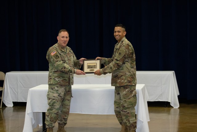 Command Chief Warrant Officer 5 Harold (Hal) Griffin accepts a token of appreciation at a pre-graduation reception at Warrant Officer Candidate School at Fort McClellan, Alabama on July 30, 2020. The accelerated Warrant Officer Candidate School course was conducted to help alleviate the backlog of warrant officer candidates in the U.S. Army Reserve (National Guard Photo by Staff Sgt. William Frye.)