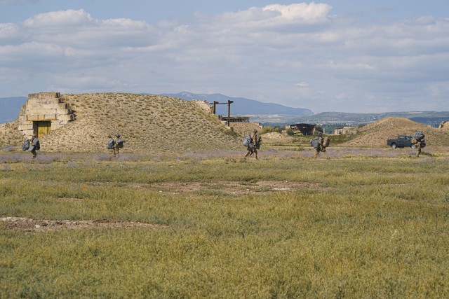 U.S. paratroopers, assigned to the 173rd Airborne Brigade, move to the assembly point after completing their airborne operation during the Noble Partner 20 exercise at Vaziani Training Area, Georgia, Sept. 1, 2020. Exercise Noble Partner is designed to enhance regional partnerships and increase U.S. force readiness and interoperability in a realistic, multinational training environment. The exercise allows participants to conduct airborne operations, situational training exercises, live-fire exercises and combined mechanized maneuvers.