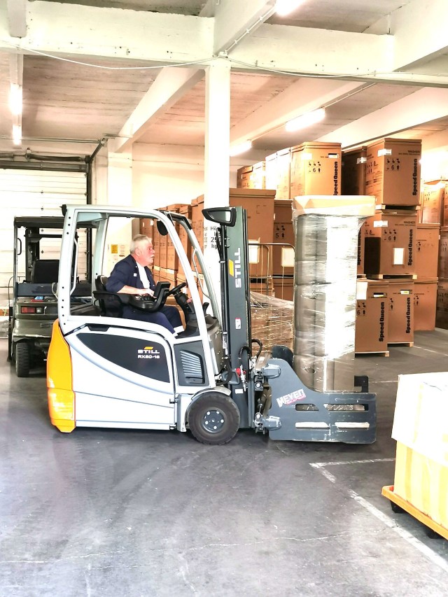 Frank Eigner, Baumholder Military Community Furnishings Management Office warehouse employee, gingerly uses a forklift to take some furniture out of a storage bay. The BMC FMO warehouse holds between 8, 000 - 12,000 pieces of furniture at any one time. 
(Photo by Sasha Winter)