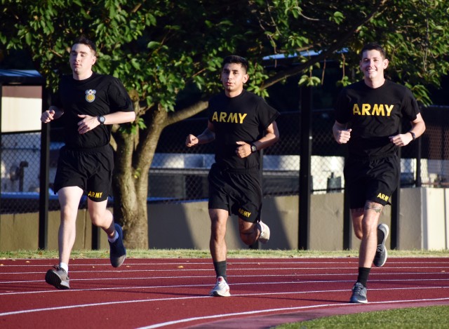 From left, Capt. Dustin Thomas, assigned to Medical Activity Japan, Camp Zama; Spc. Max Ramirez, assigned to the 38th Air Defense Artillery Brigade; and Sgt. Joseph Rudolph, also assigned to MEDDAC-J, train for the Army Ten-Miler at Zama Middle High School, Camp Zama, Japan, Aug. 27.