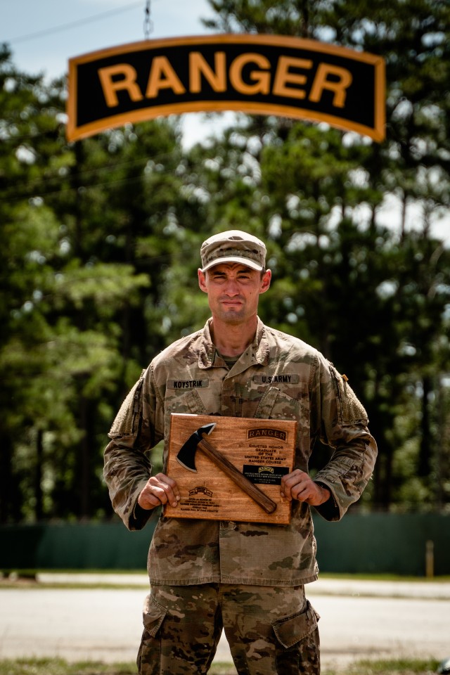 Sgt. Dmitry Koystrik, a team leader assigned to Headquarters and Headquarters Company, 2nd Battalion, 504th Parachute Infantry Regiment, 1st Brigade Combat Team, 82nd Airborne Division, poses for a photo with his plaque after graduating U.S. Army Ranger School as the Distinguished Honor Graduate at Fort Benning, Georgia, August 27, 2020.