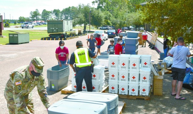 Joint Readiness Training Center and Fort Polk volunteers man a Red Cross distribution point at the installation’s Siegfried Youth Activity Center, handing out supplies to help those affected by Hurricane Laura.