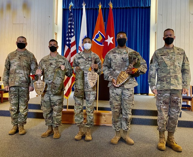 From left to right, Sergeant Major Randy Gillespie, the 311th SC (T) Command Sergeant Major, Spc. Raymond Rosier, G-1 Office of the 311th SC (T), Spc. Jalani Sanders and Staff Sgt. Michael Johnson both assigned to the 307th Expeditionary Signal Battalion and Brig. Gen. Jan C. Norris, commanding general, 311th SC (T).