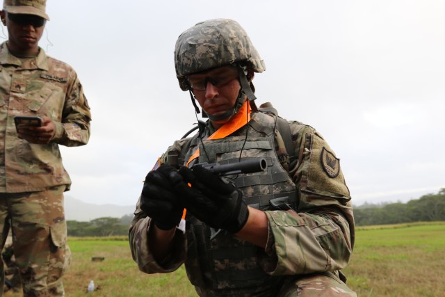 Spc. Raymond Rosier, G-1 Office, 311th Signal Command (Theater) attempts to assemble an M-17 pistol during the 311th SC (T) Best Warrior Competition, July 27-29, in which eight of the command’s Soldiers vied for the top spots as this year's Soldier of the year, NCO of the year and Army Reserve Soldier of the year.
