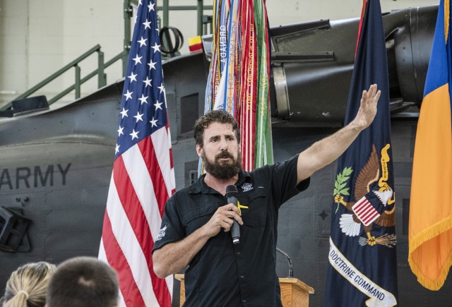 U.S. Army Master Sgt. (Ret.), and double amputee Chris Corbin addresses a group of U.S. Army Advanced Individual Training students at a military resiliency training session aimed at bringing awareness to suicide prevention within the Army at an...