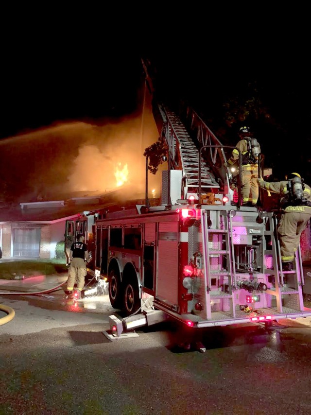 Fort Polk DES firefighters use a ladder engine truck to  battle a house fire on Fort Polk Sept. 7.